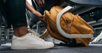 Backpack fitting neatly under an airline seat